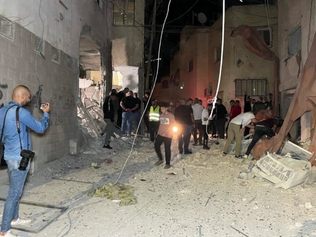 people inspect the damage after an israeli strike hit a compound beneath a mosque that the israeli military said was being used by militants to organize attacks in jenin refugee camp in the israeli occupied west bank october 22 2023 photo reuters